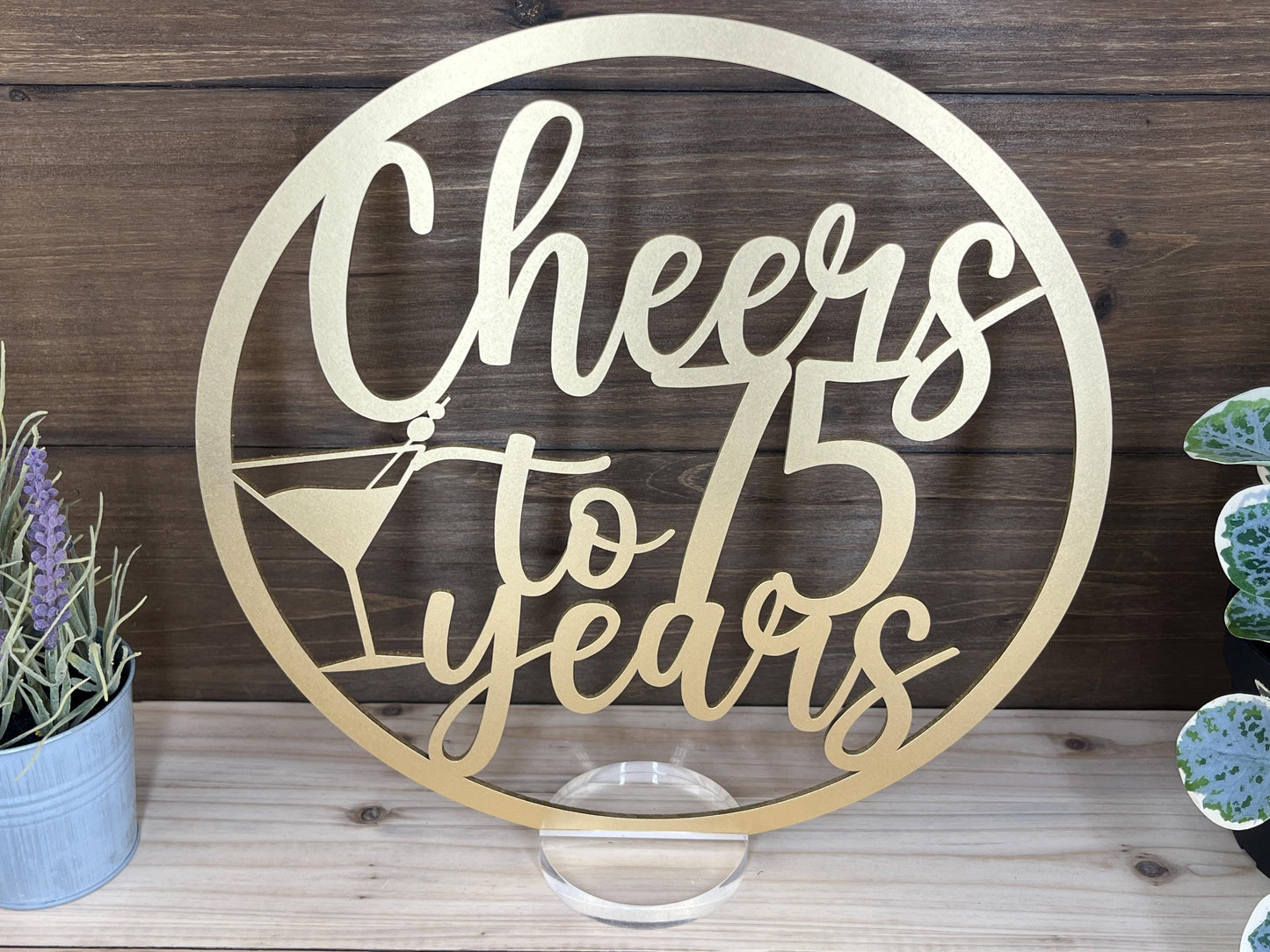 a metal sign that says cheers to five years
