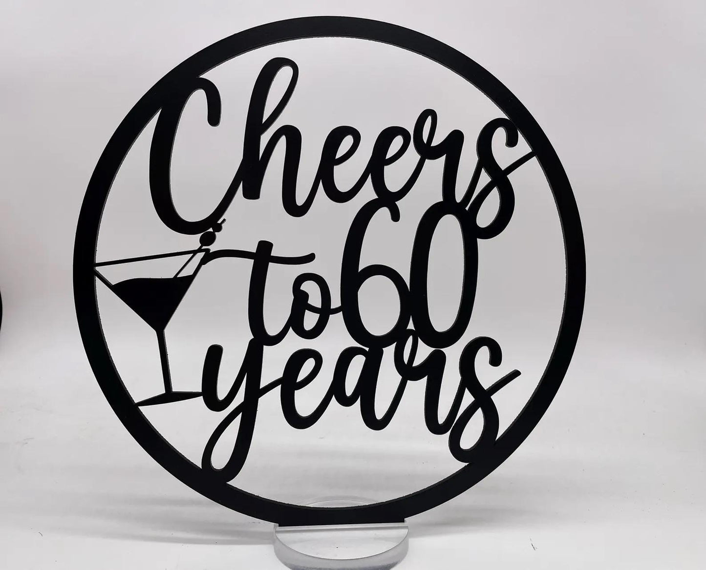 a cake topper that says cheers to 60 years