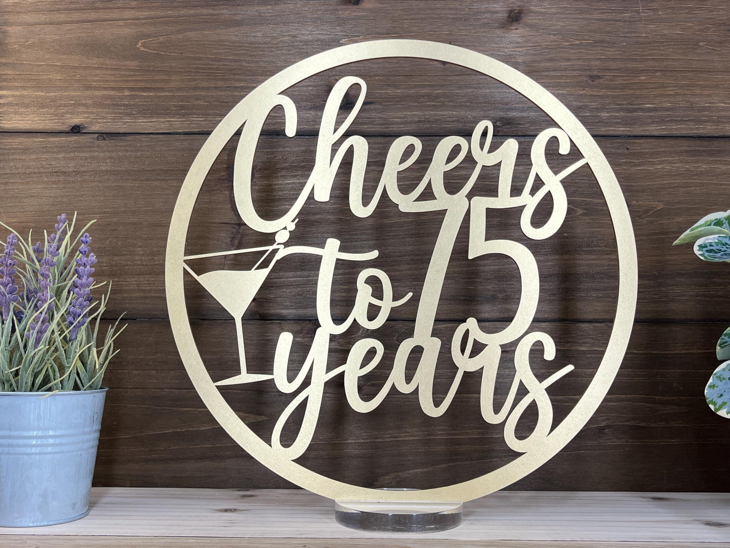 a metal sign that says cheers to 75 years