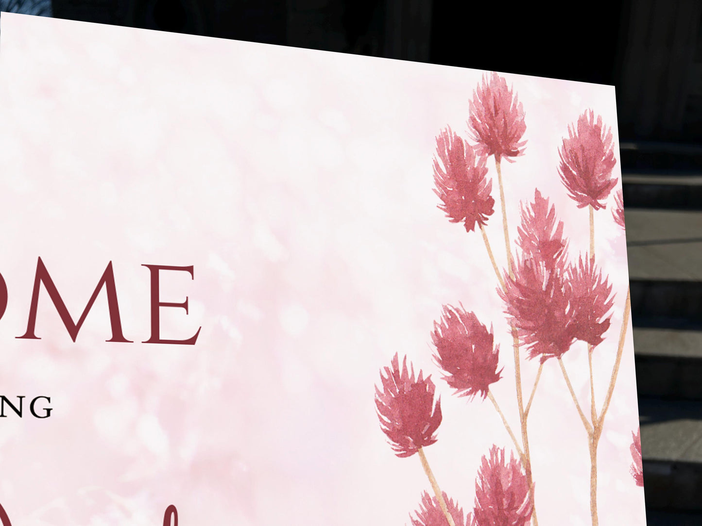 a close up of a sign with flowers on it