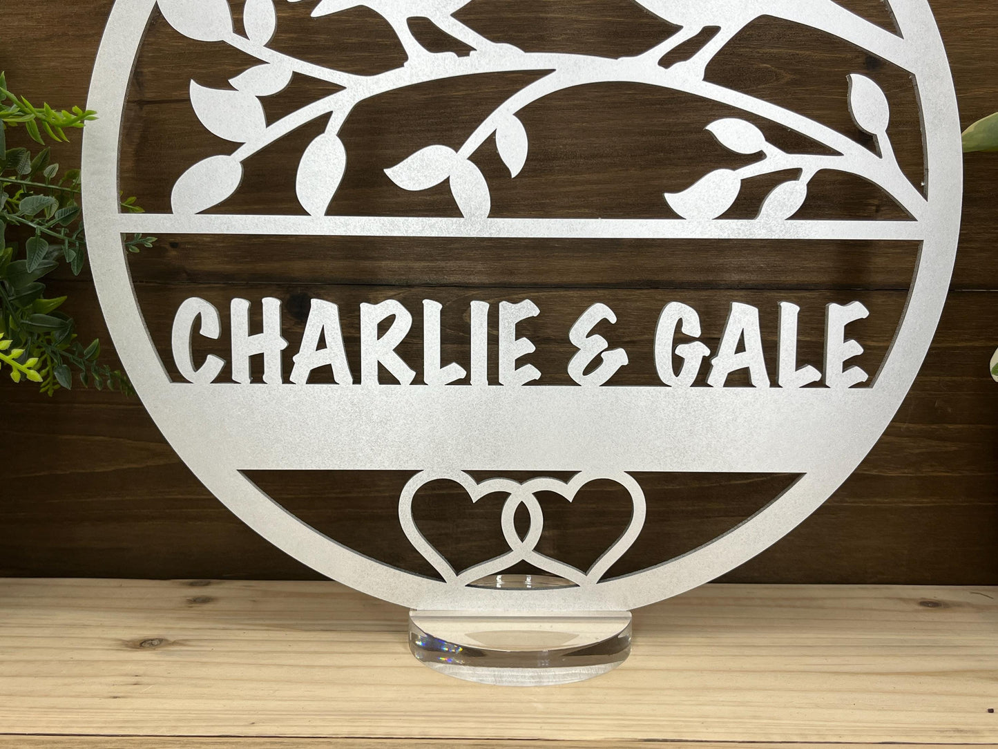 a metal sign that says charlie and gail on it