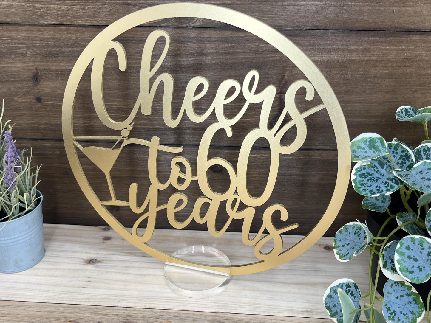 a metal sign that says cheers to all years