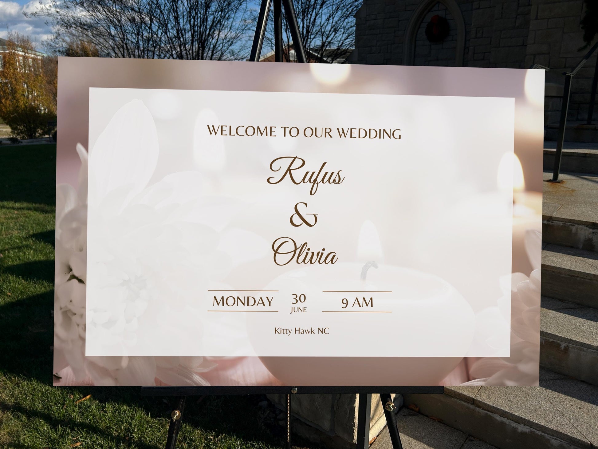 a welcome sign for a wedding in front of a church