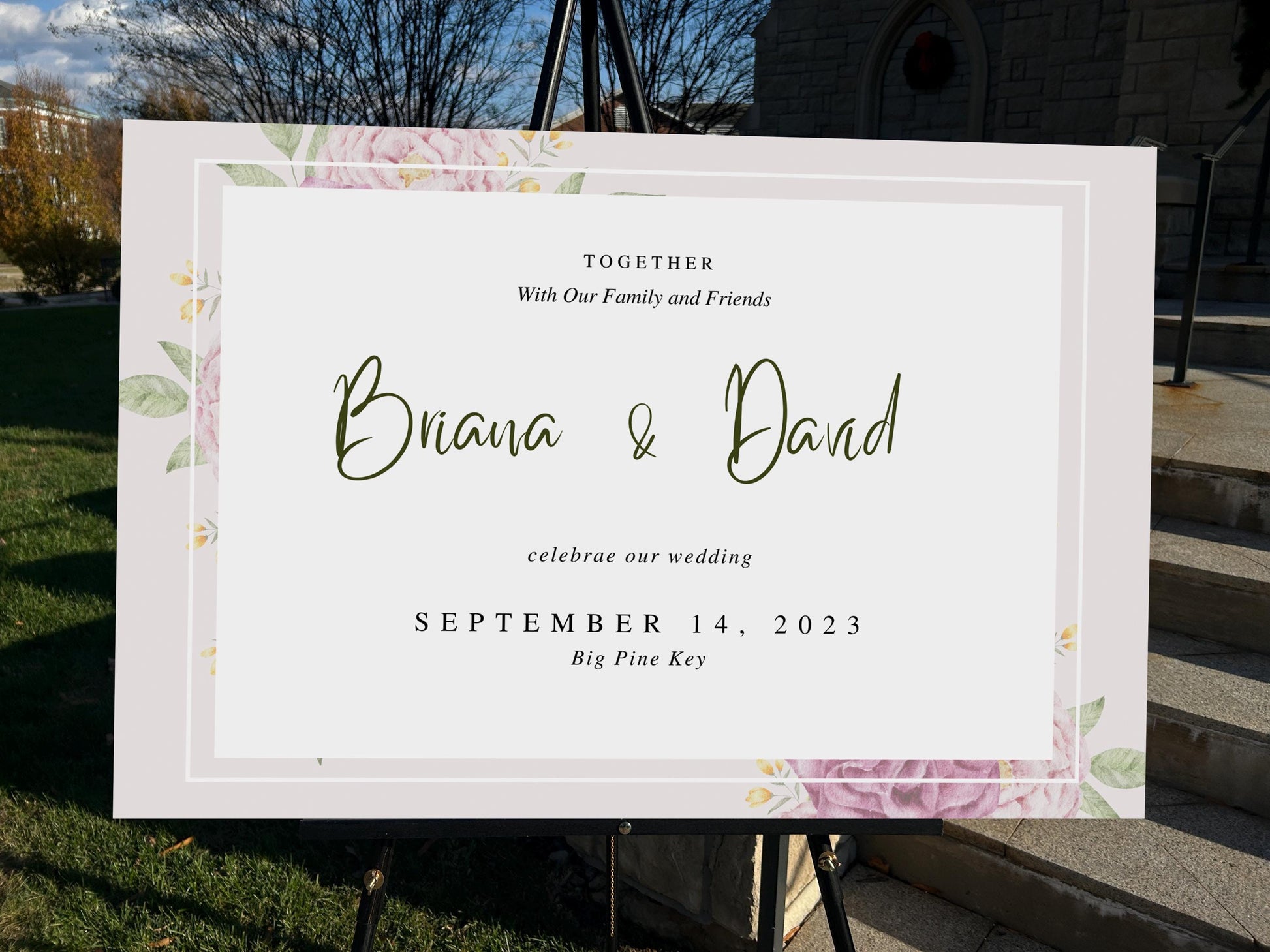 a wedding sign in front of a church