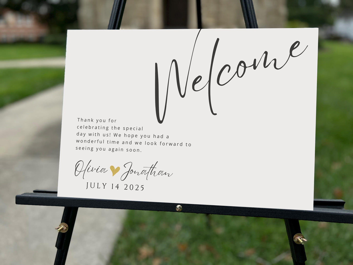 a welcome sign on a easel in front of a house