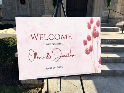 a welcome sign for a wedding in front of a church