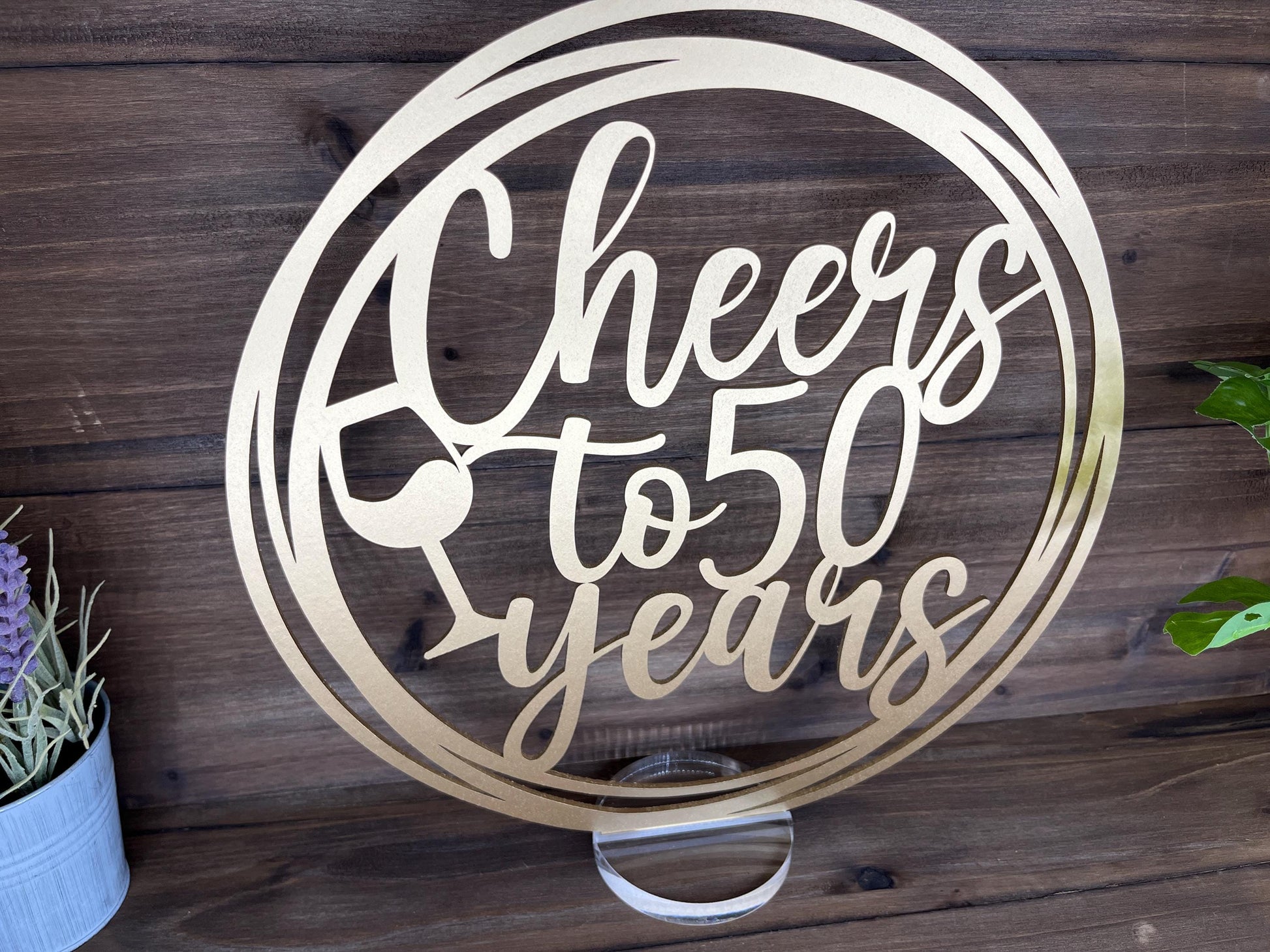 a metal sign that says cheers to five years