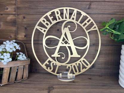 a metal sign that says abernaty established in a circle