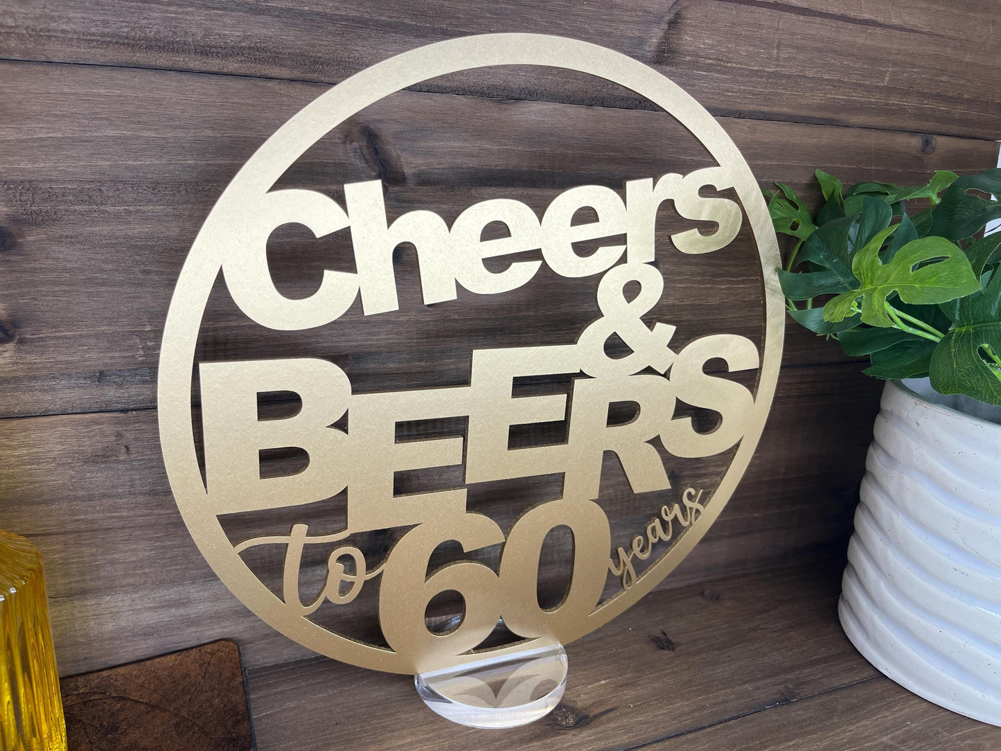 a metal sign that says cheers and beers to go